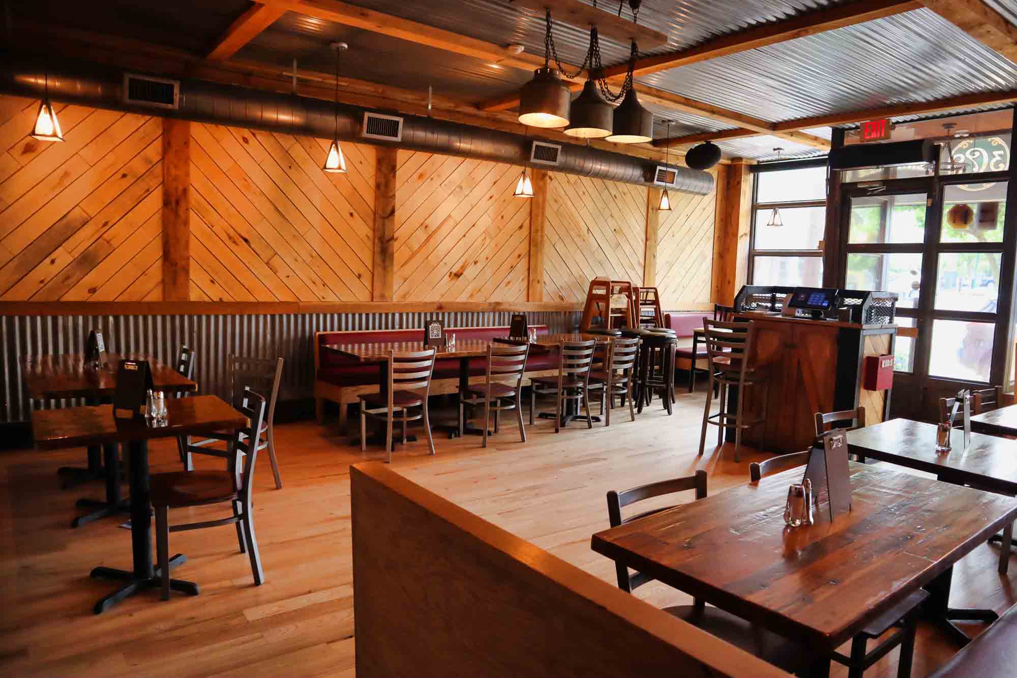 Chevron wood dining room with pendant lights